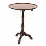 A 19thC mahogany tripod table, the circular top with two ribbed border, on a tripod base, 73cm high,