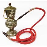 An Eastern shisha pipe, the main body in steel with a gold coloured coating, various piercing and
