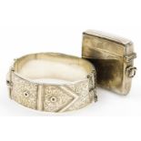 Two items of silver, to include a George VI silver hinged bangle, the front with buckle scroll and