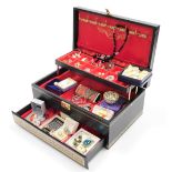 A black faux leather jewellery box and contents, comprising two gold plated dress rings, earrings,