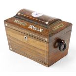 A Victorian rosewood inlaid tea caddy, the dome top with mother of pearl inlay, on two wooden ring