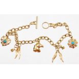 A charm bracelet, with various wings, eagles and charms some set with turquoise, yellow metal,