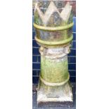 A Victorian stoneware chimney pot, of turret form, on a square foot, 99cm high, 29cm diameter.
