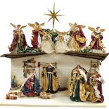 A Golden Treasures Nativity set, the plaster base depicting courtyard scene, with Tree of Life to