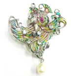 A plique-a-jour Art Nouveau style pendant/brooch, set with topaz, rubies, marcasite, etc, with