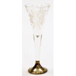 A cut glass champagne flute, on a white metal base, stamped 36066, the top with floral pierced