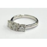 An 18ct gold diamond three stone ring, set with three round brilliant cut stones, each in claw