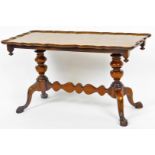 A mid 20thC walnut coffee table, with piecrust edge raised on double baluster columns joined by a