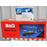 A B&Q precision deep cut mitre saw and a flood light. (2 boxed)