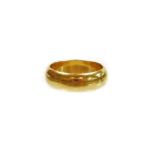 An 18ct gold wedding band, of plain design, hallmarks rubbed, ring size J½, 5.8g all in.