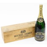 A cased bottle of Michel Genet champagne, grand reserve 150cl Chouilly, in wooden case.