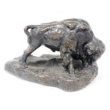 A modern bronzed resin sculpture of a bison with head down, on rustic base, 22cm high.