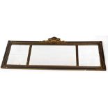 An Edwardian wooden framed gilt mirror, of sectional design, with large rectangular mirror plate