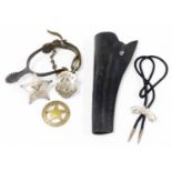 A group of American Wild West badges, uniform and gun holster, to include a black leather gun