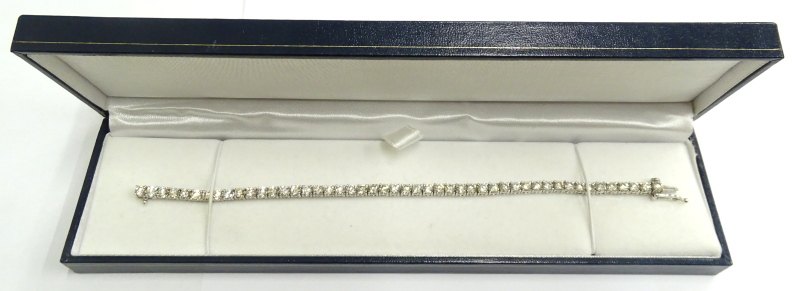 A diamond tennis bracelet, set with round brilliant cut diamonds, totalling approx 9.25cts, in white