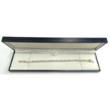 A diamond tennis bracelet, set with round brilliant cut diamonds, totalling approx 9.25cts, in white