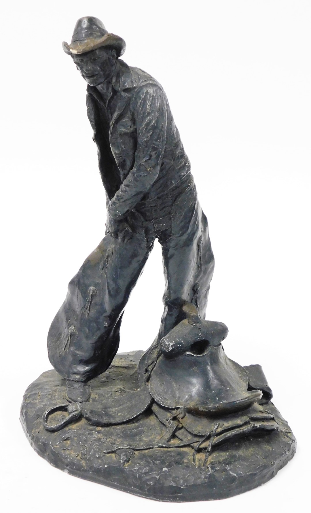 After Michael C Garman. Taking The Rough Off, bronze finished resin figure of a cowboy, signed and