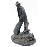 After Michael C Garman. Taking The Rough Off, bronze finished resin figure of a cowboy, signed and