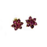 A pair of 9ct gold garnet set cluster earrings, each with butterfly backs, 1g all in, boxed.