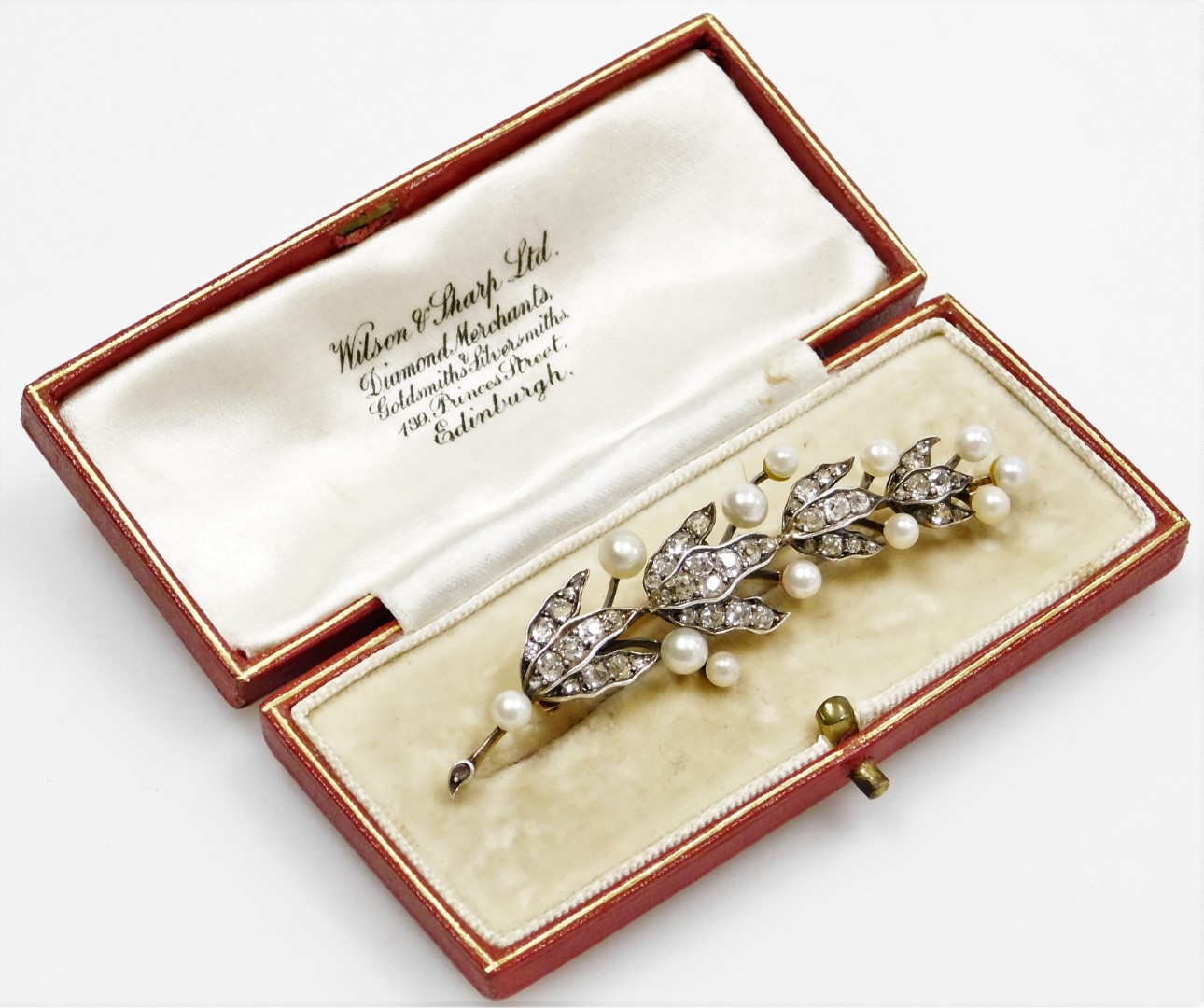 A Victorian diamond and pearl leaf brooch, the brooch formed of a leaf branch with three strand - Image 2 of 2