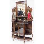 A late 19thC/early 20thC mahogany mirrored back display cabinet, with graduated triple mirror top