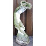 A reconstituted stone garden ornament, of a boy holding a shell, on an oval base, 90cm high, 26cm