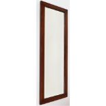 A mahogany framed early 20thC wall mirror, of plain rectangular design, 120cm x 42cm.