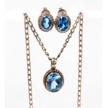 A Klimek earring and necklace set, each in silver with a central aquamarine coloured stone, with