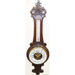 A late 19thC mahogany aneroid barometer, with carved flower design, marked Lloyd Paynet and Amiel