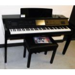 A Yamaha Clavinova CVP-809, in a black high gloss finish, with electronic touch screen panel, on a