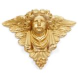 A gilt gesso wall plaster wall shelf, with cherub figure, 30cm high, 46cm wide. (AF)