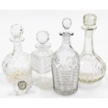 A group of glassware, to include four cut glass decanters and a Waterford crystal mantel clock.