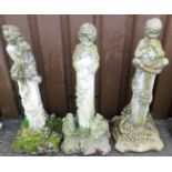 A set of three cast garden ornaments, each of children in various poses, one of a girl on a