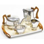 A Piquot ware four piece tea service, comprising coffee pot, milk jug, sugar bowl, teapot and tray.