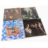 Four Rolling Stones albums, to include 33rpm long playing, in multicoloured presentation sleeve with