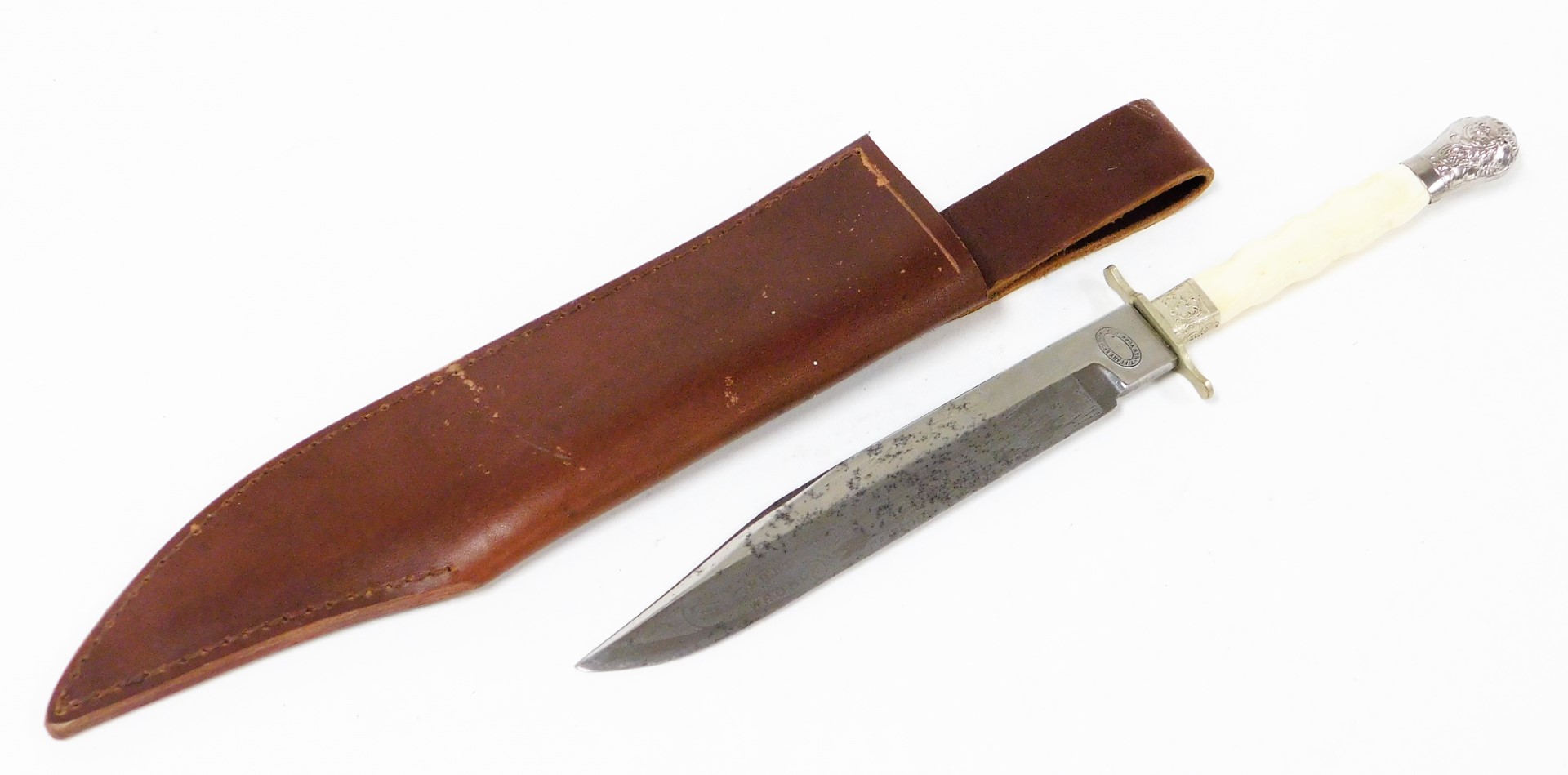 A Tiffany Broadway American knife, with a bone handle and silver plated scroll design ends, the