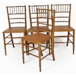A set of four 19thC gold painted dining chairs, turned to simulate bamboo, 75cm high.