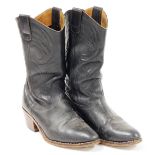 A pair of black leather cowboy boots, stamped Stetson, size unknown.