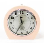 A Metalair Art Deco style clock, with a silver coloured face, in pink Bakelite surround, 16cm