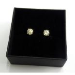 A pair of 18ct gold diamond stud earrings, each set in four claw design, totalling approx 1.45cts,