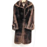 A Gonell brown fur coat, with a brown material lining.
