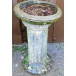 A bird bath, the circular top on a plain stem, 60cm high, 33cm diameter.