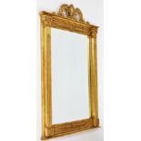 An early 20thC gilt framed wall mirror, with rectangular mirror plate on Corinthian column