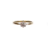 An 18ct white gold diamond solitaire ring, set with a round brilliant cut diamond measuring 0.33