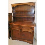 An Old Charm oak finish dresser, the top with two shelves on sideboard base, with two long drawers