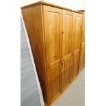 A pine triple wardrobe, 170cm high, 150cm wide, 50cm deep.