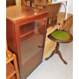 A group of furnishings, to include a mahogany and leather inset tripod table, a side cabinet, a