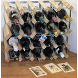 Two wine racks and contents, to include various wines, liquors, and sparkling wines, together with