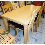 A beech effect kitchen table and six (4+2) associated chairs, two oak, the table 76cm high, 186cm