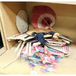 Various Oriental wicker hand fans, of varying colours and designs. (A quantity)